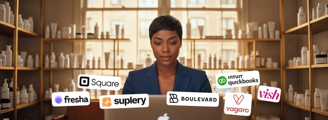 Salon owner working on a laptop surrounded by product shelves, with logos of top salon inventory software tools including Suplery, Square, Fresha, QuickBooks, Vagaro, Vish, and Boulevard.