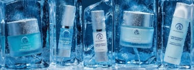  Ice Elements skincare collection, including Miracle Gel, Eye Serum, Peptide+ Serum, Moisturizer, and Body Soufflé, displayed in frozen ice blocks.